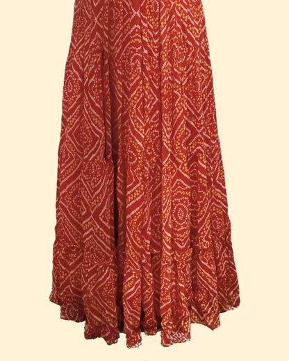 Sleeveless Bandhani-Style Gown with Mirror Work Flared Skirt – Cultural Elegance