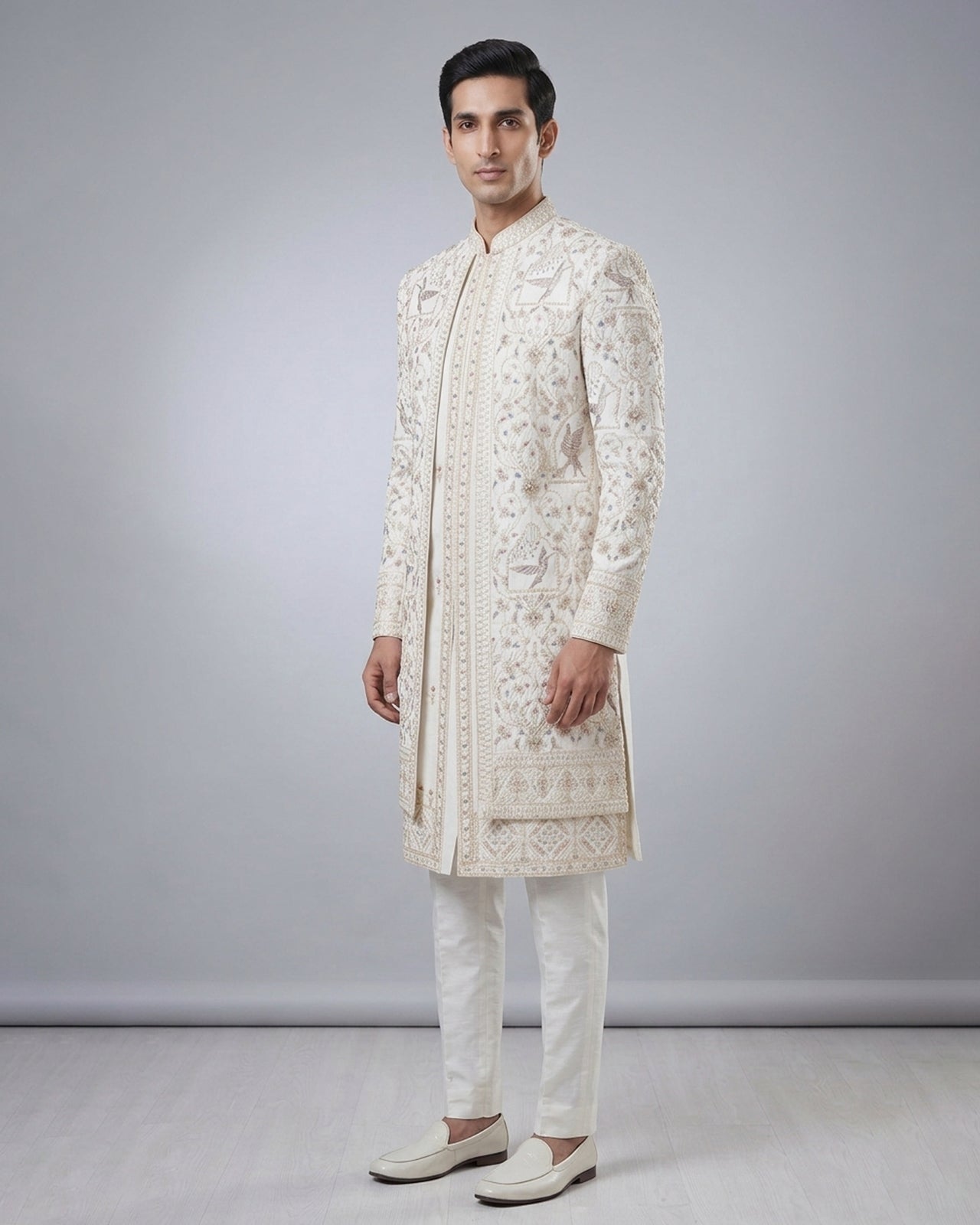 Cream Sherwani with Gold & Pastel Embroidery – Royal Wedding & Festive Attire