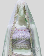 Peacock Whisper Bridal Designer Lehenga Choli – Regal Embroidery in Pastel Tones