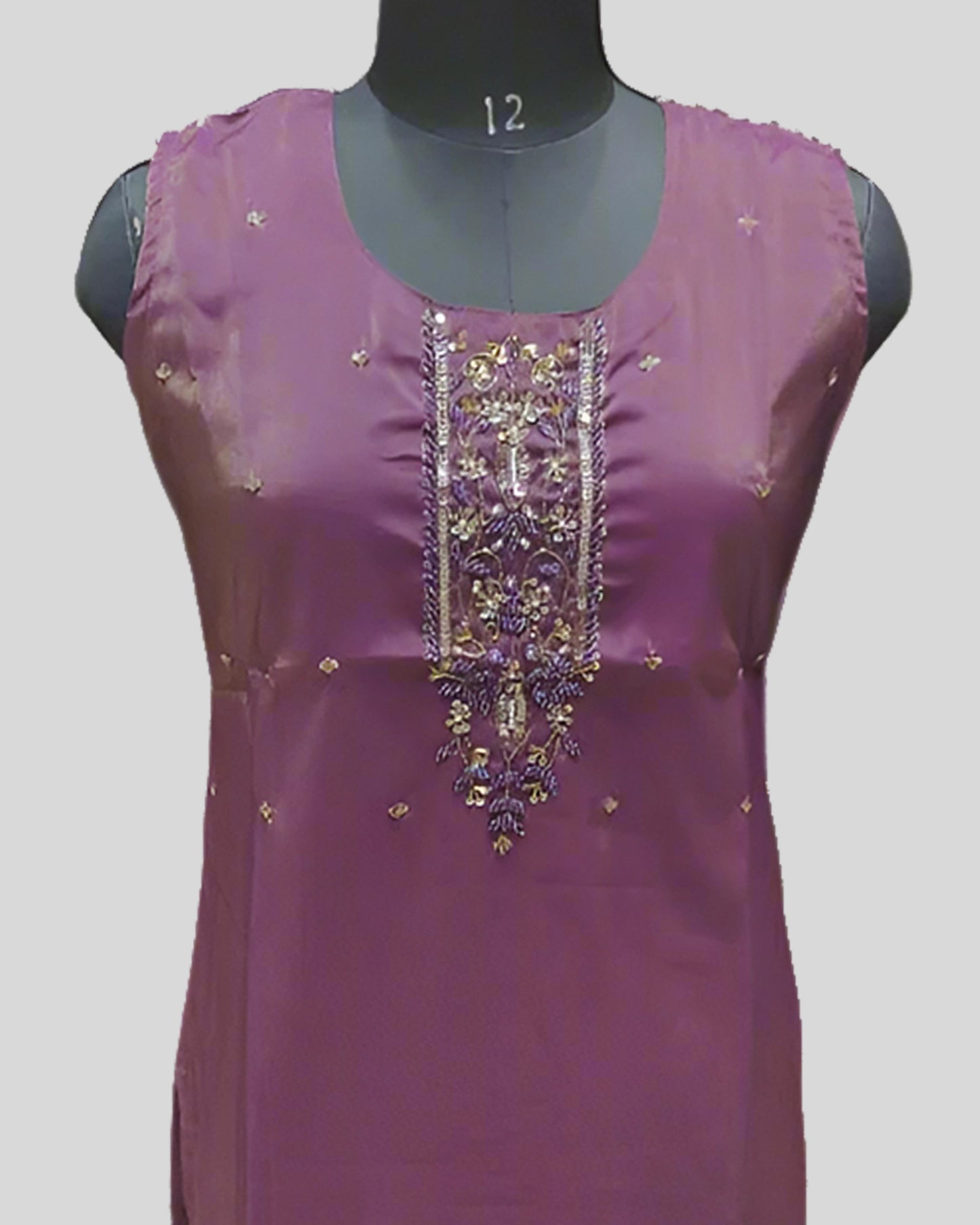 Purple Sleeveless Embroidered Kurti – Ornamental Gold Threadwork & Gradient Hemline