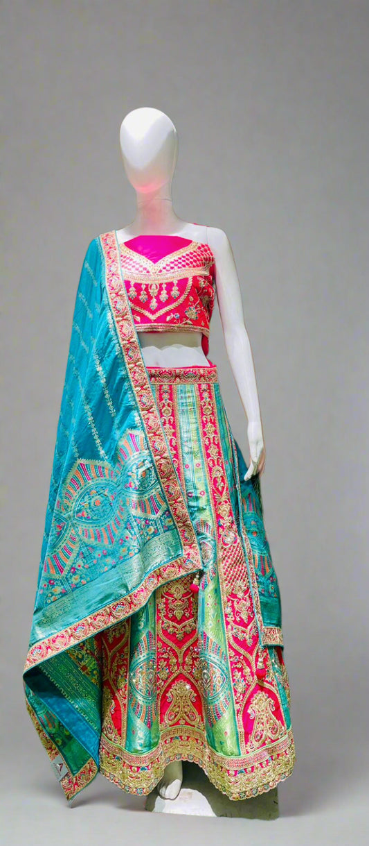 Heritage Flame Lehenga Choli – Red & Green Embroidery with Regal Turquoise Accent