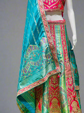 Heritage Flame Lehenga Choli – Red & Green Embroidery with Regal Turquoise Accent