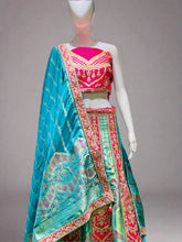 Heritage Flame Lehenga Choli – Red & Green Embroidery with Regal Turquoise Accent